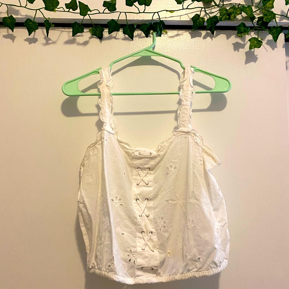 Cropped white top with eyelet details